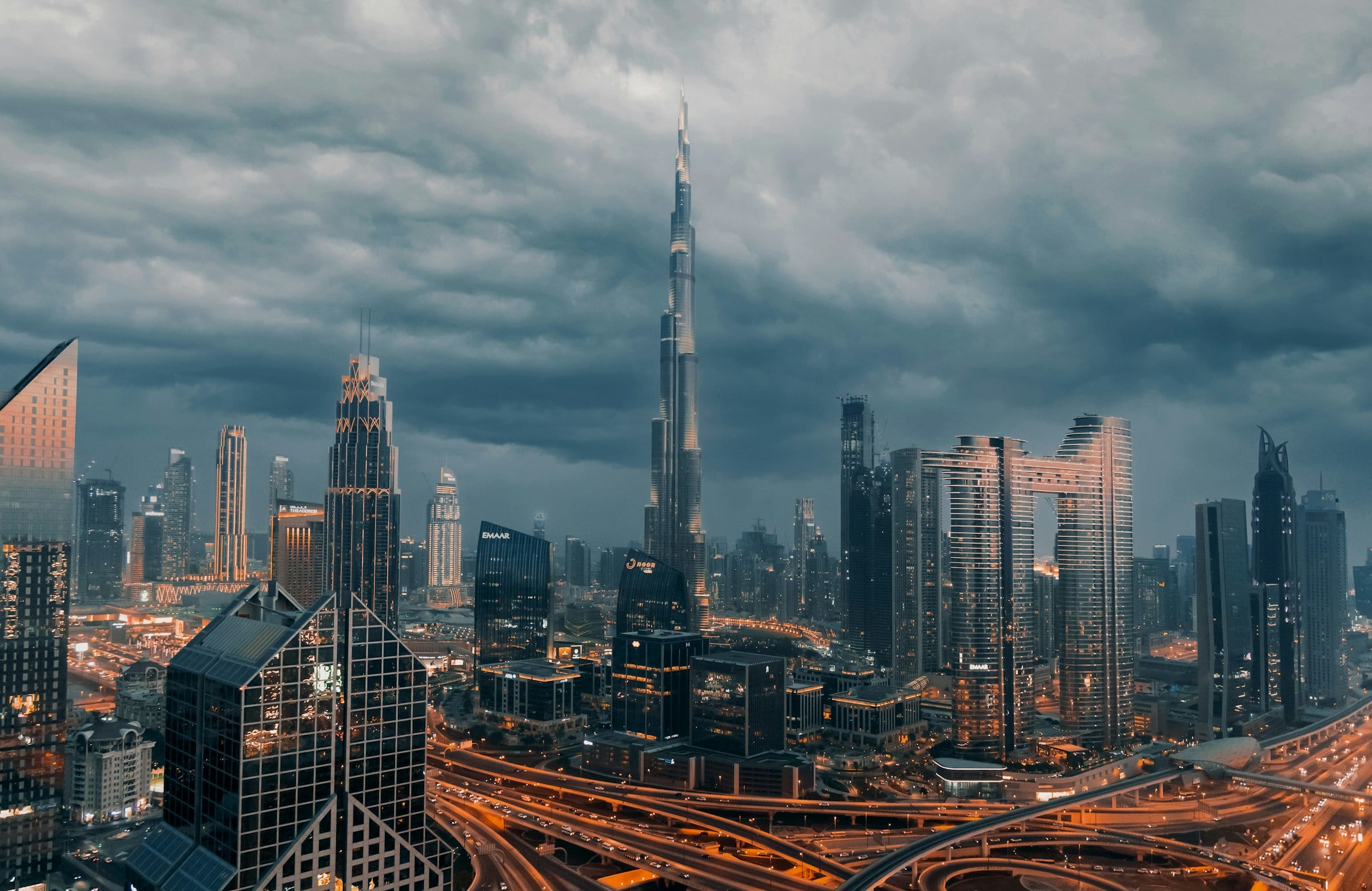 Downtown Dubai beneath storm clouds at dusk