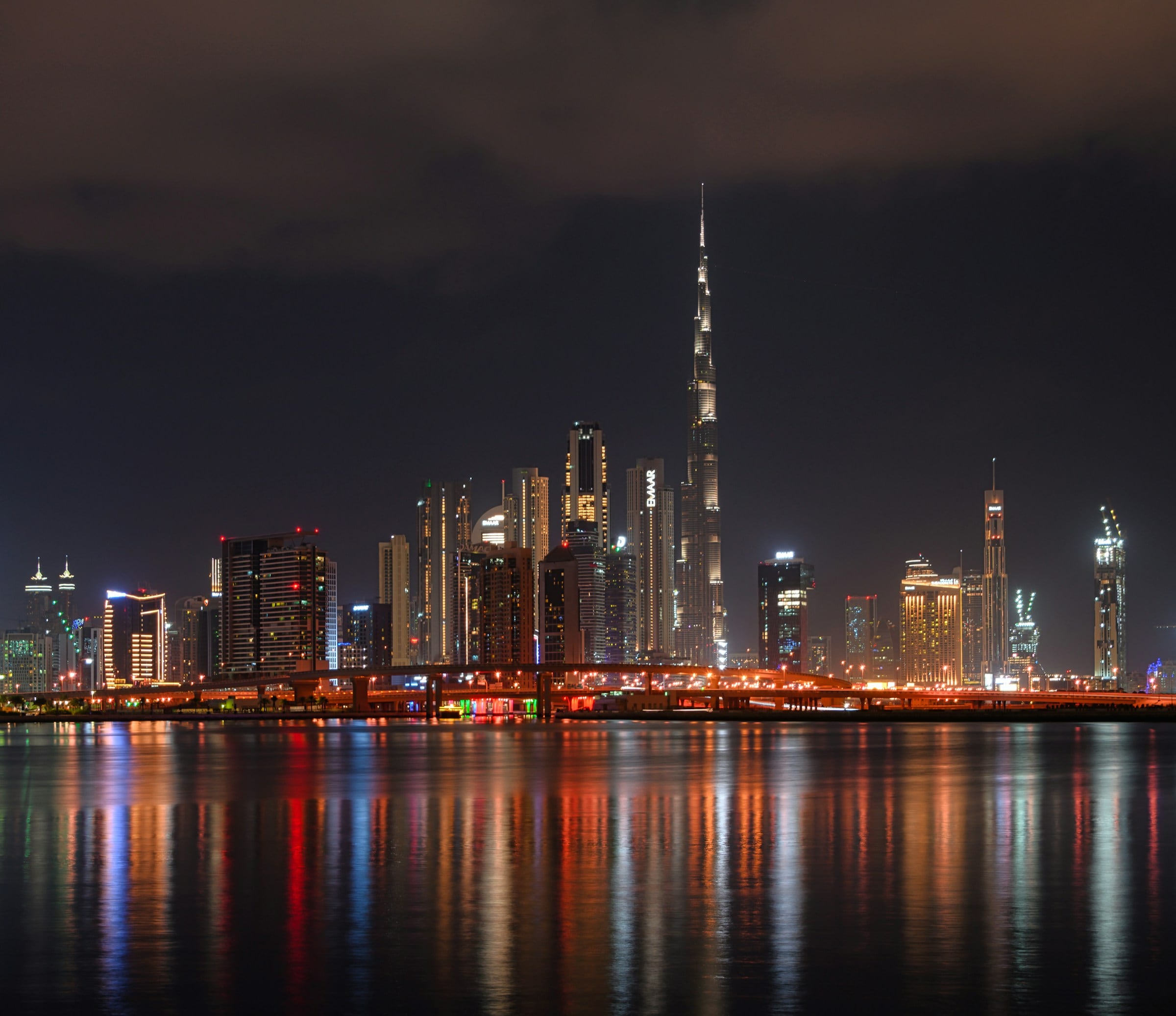 The Dubai skyline across the water at night