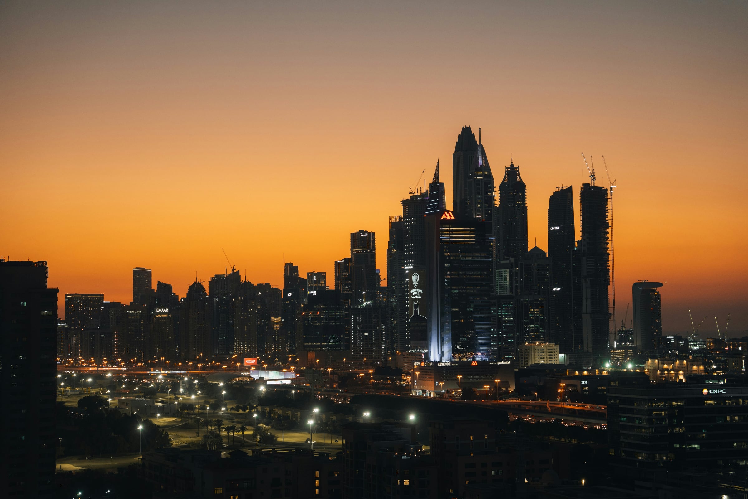 Dubai Marina towers silhouetted against the sunset