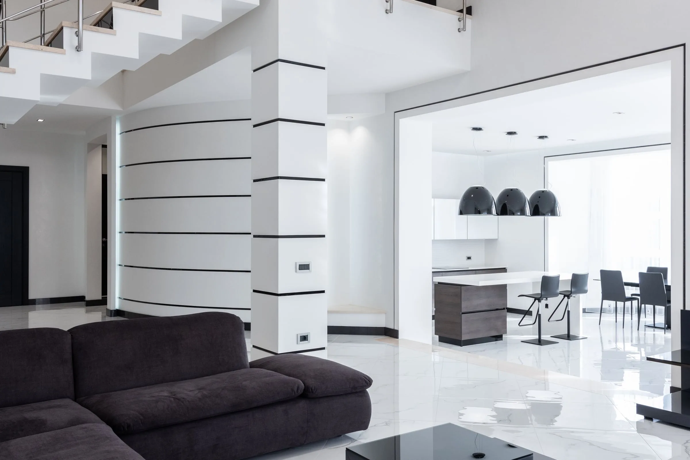 Bright open-plan living room with marble floor